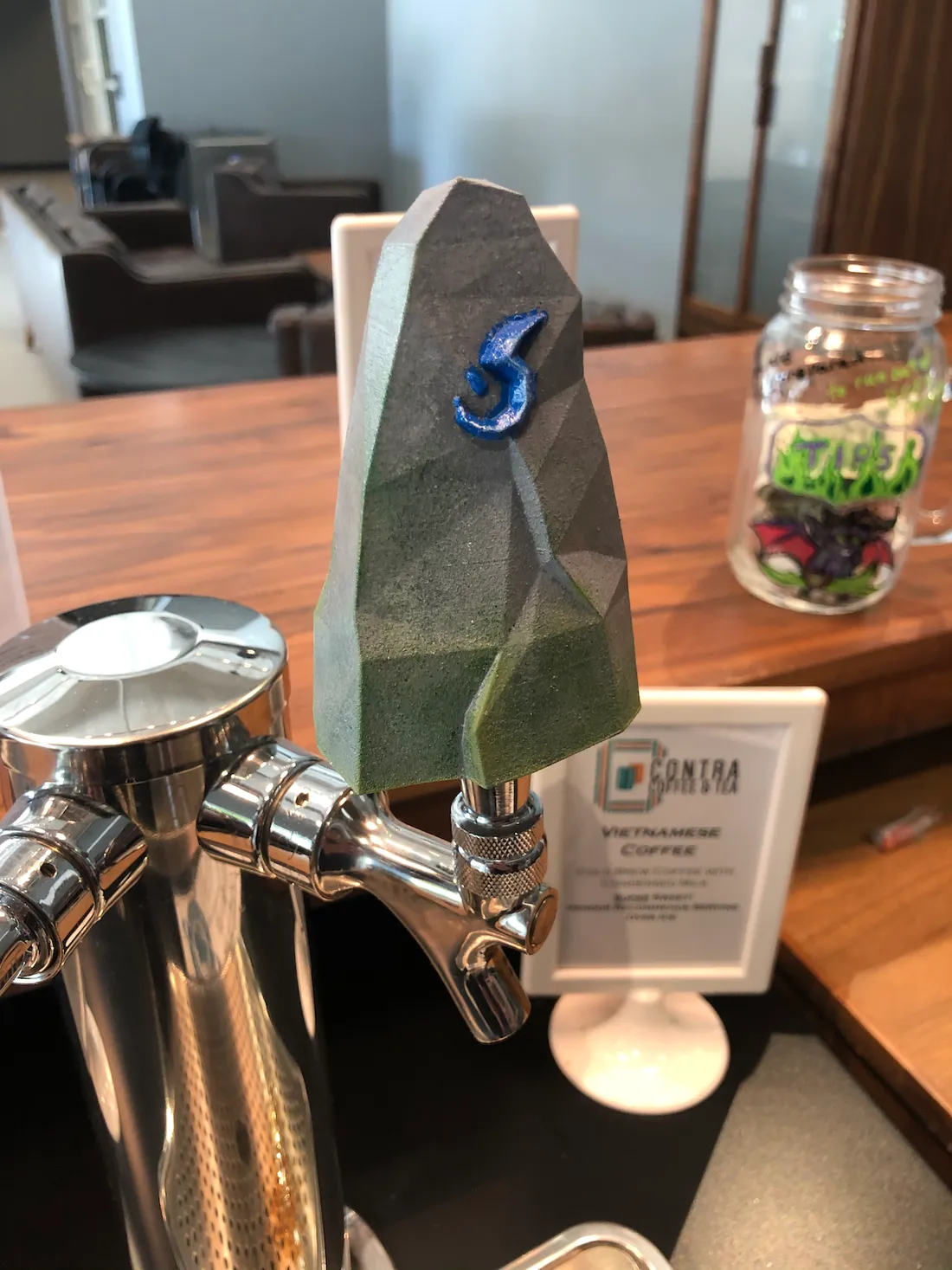 Cold brew tap handle that looks like a hearth stone from Blizzard Entertainment