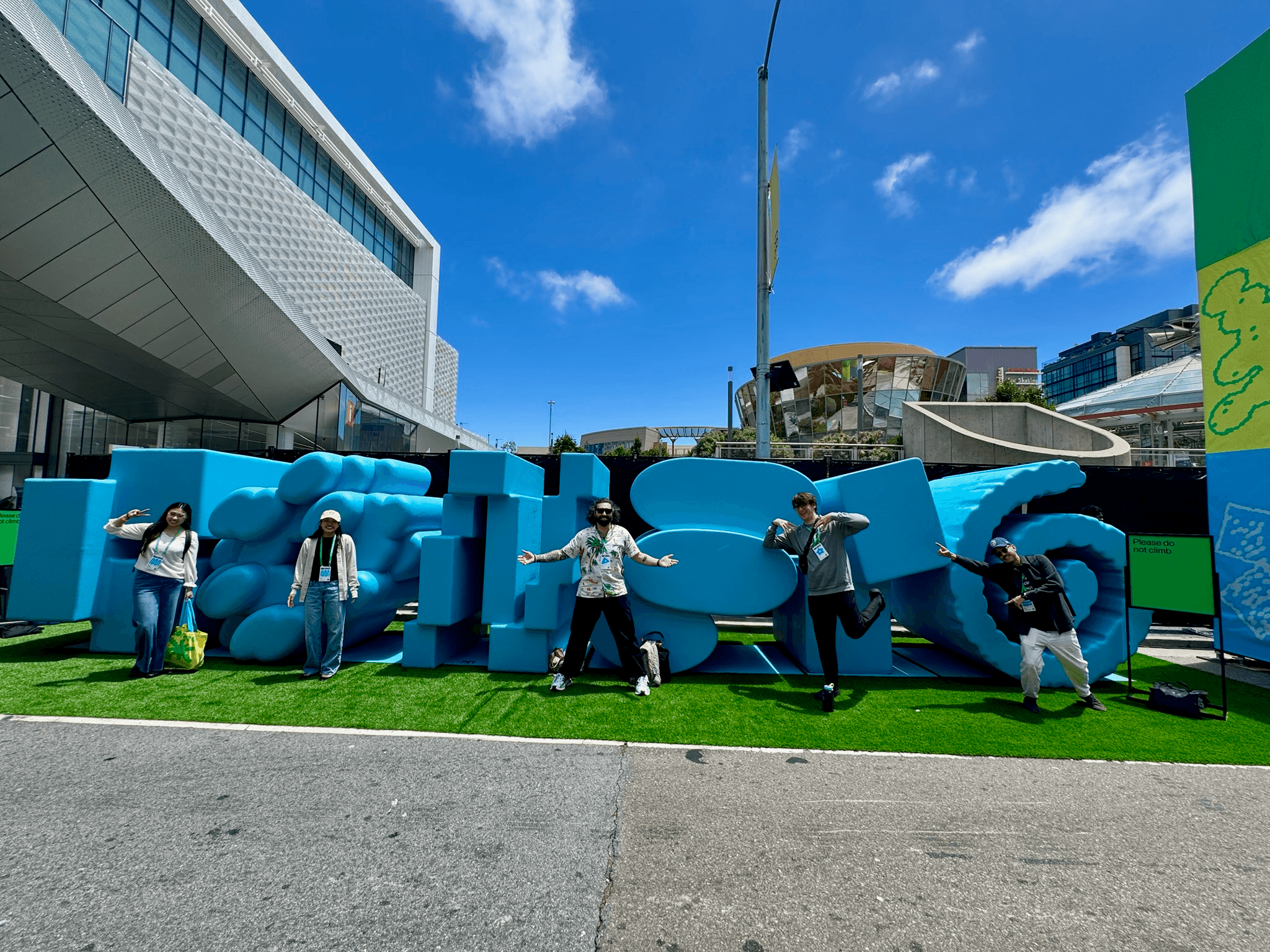 People standing in front of the Config logo