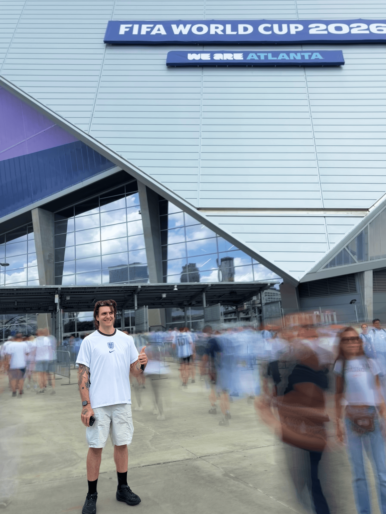 A photo of James Ives standing outside the Mercedes-Benz Stadium in Atlanta