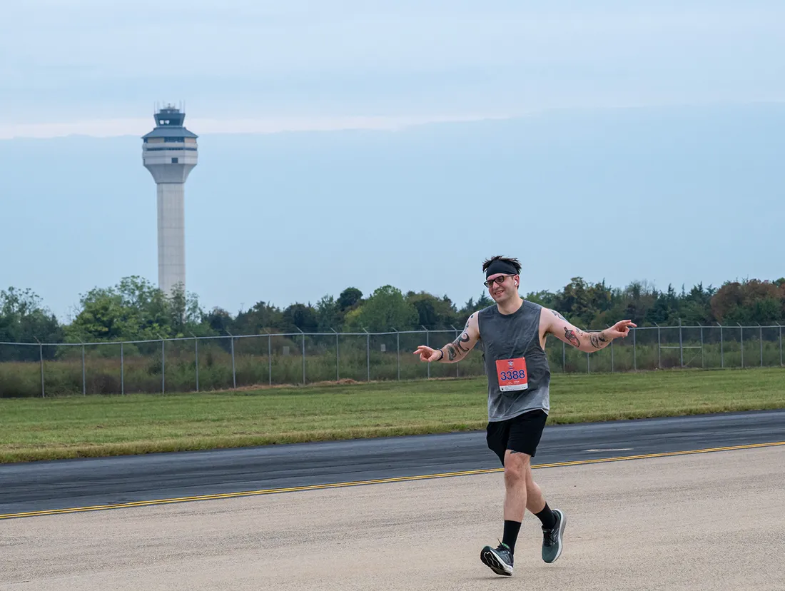 Person running outside at an airport