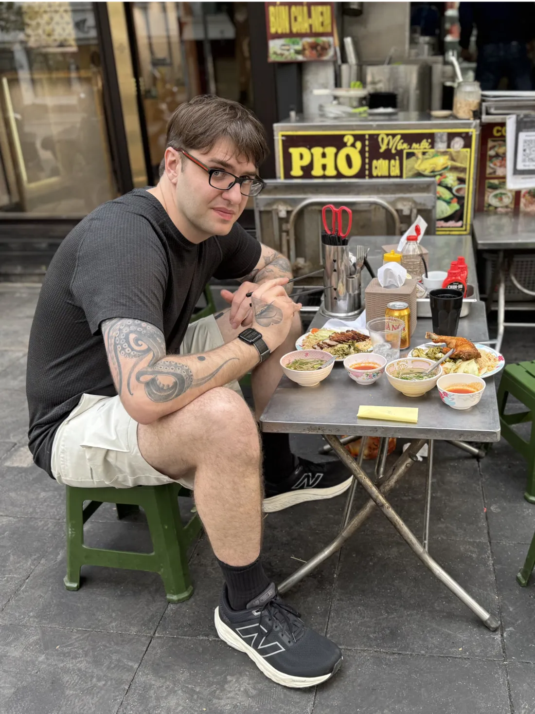 Person sitting on a stool in Vietnam