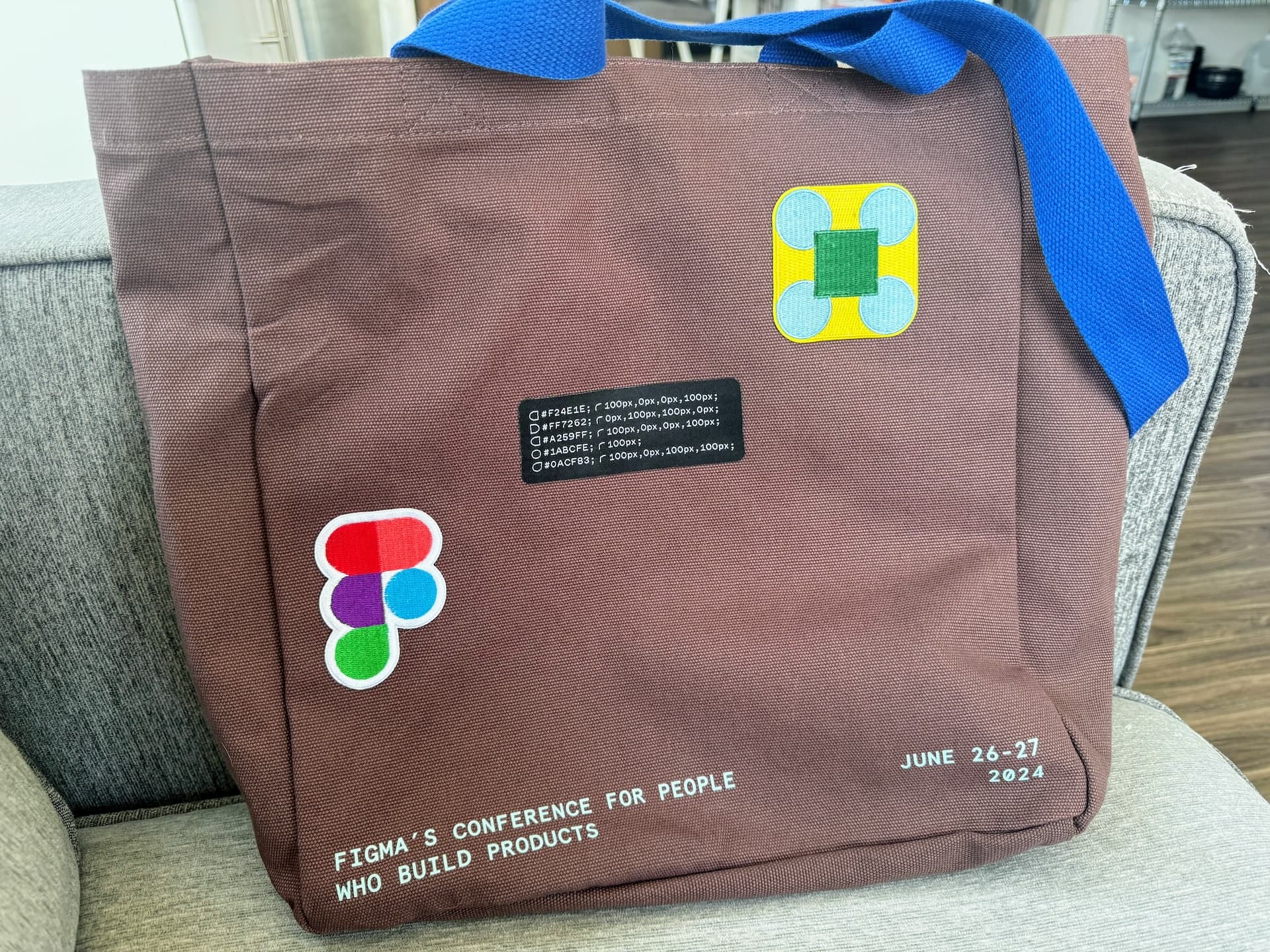 Figma tote bag with patches on it