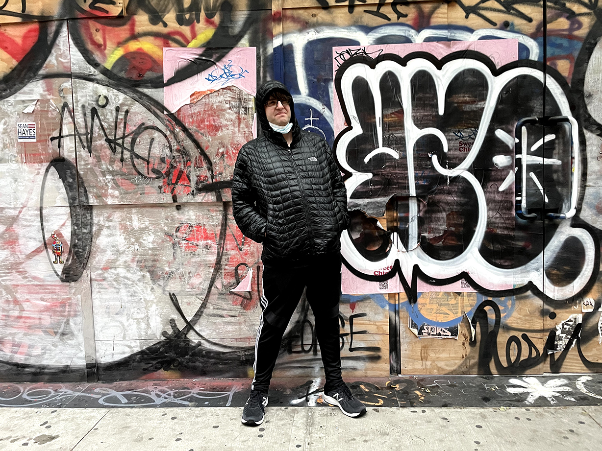 James in front of
graffiti