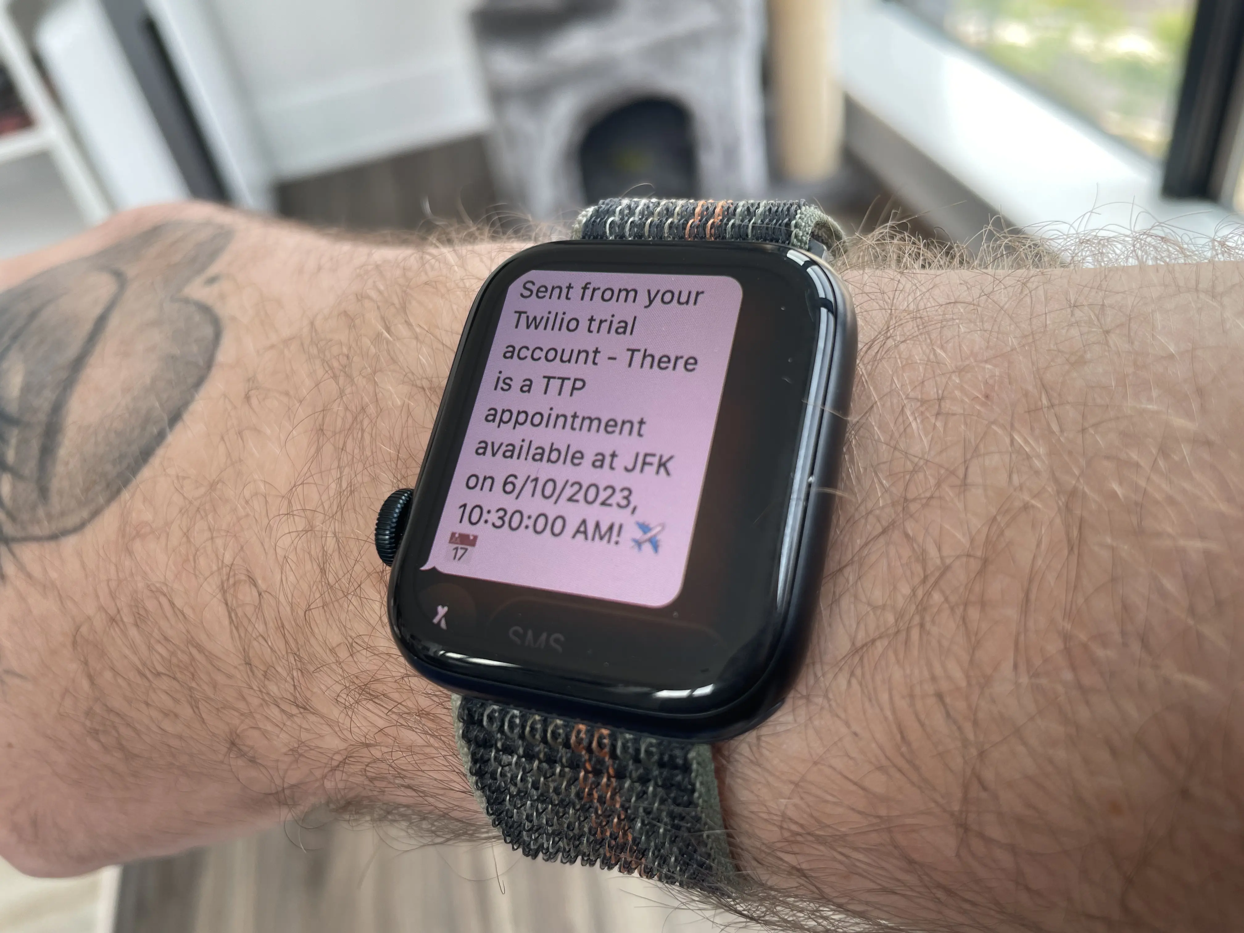 Apple watch showing a text message with the appointment details